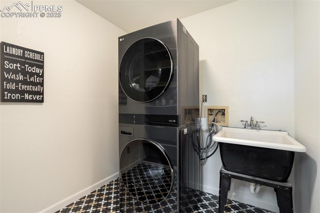 Image 41 of 50: Main level laundry and utility sink