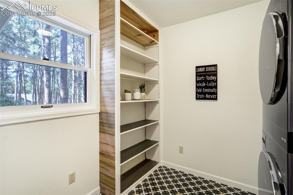 Image 42 of 50: Extra storage space in large laundry room
