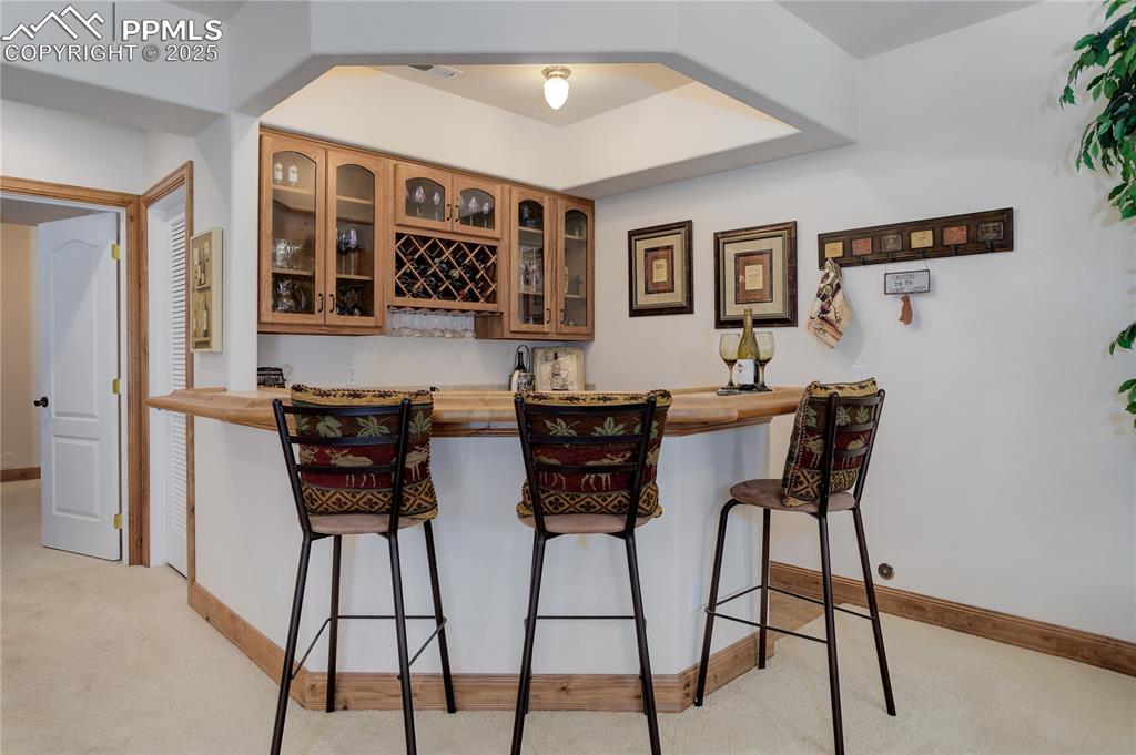 Image 25 of 41: Wet bar w/ wine fridge