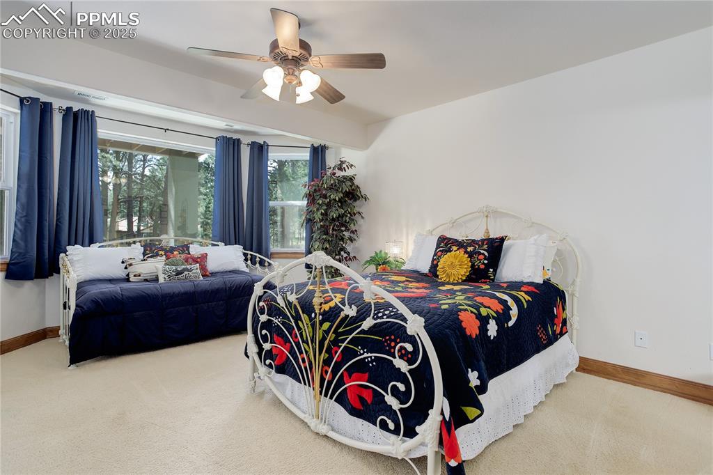 Image 26 of 41: Bedroom 2 w/ bay windows - lower level