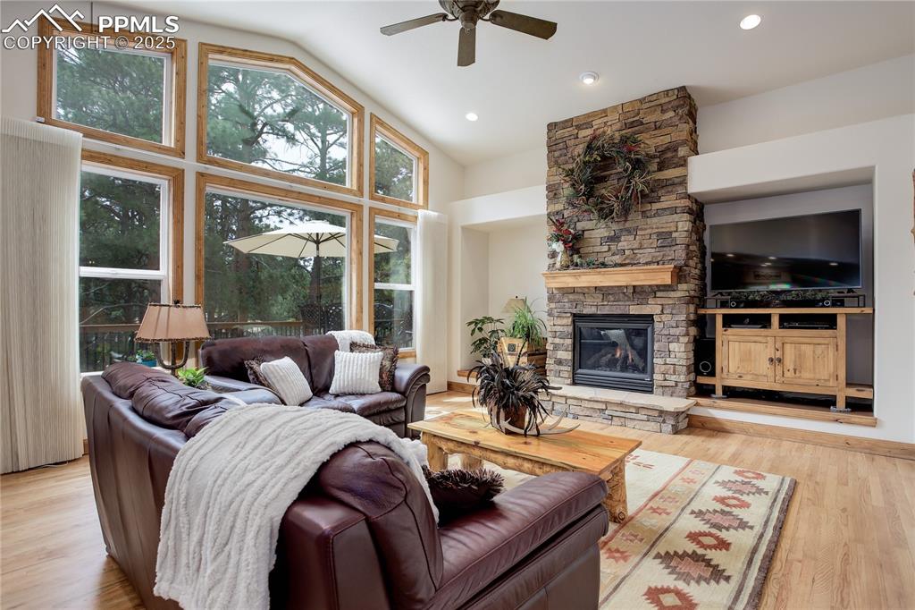 Image 3 of 41: Great room w/ fireplace & picture windows
