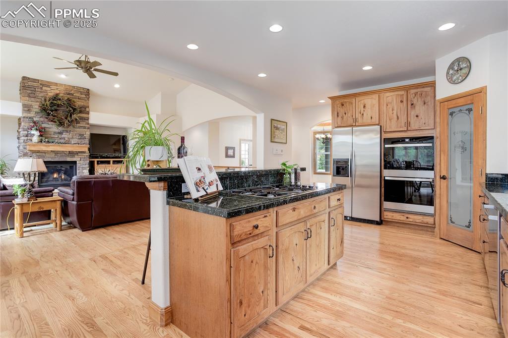 Image 6 of 41: Stone counters & walk-in pantry
