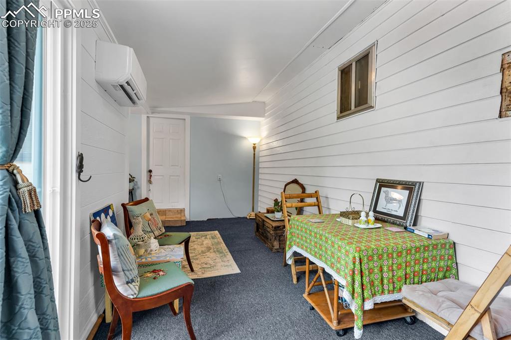 Image 10 of 44: The family room has unlimited uses as a guest bedroom, music room, project 