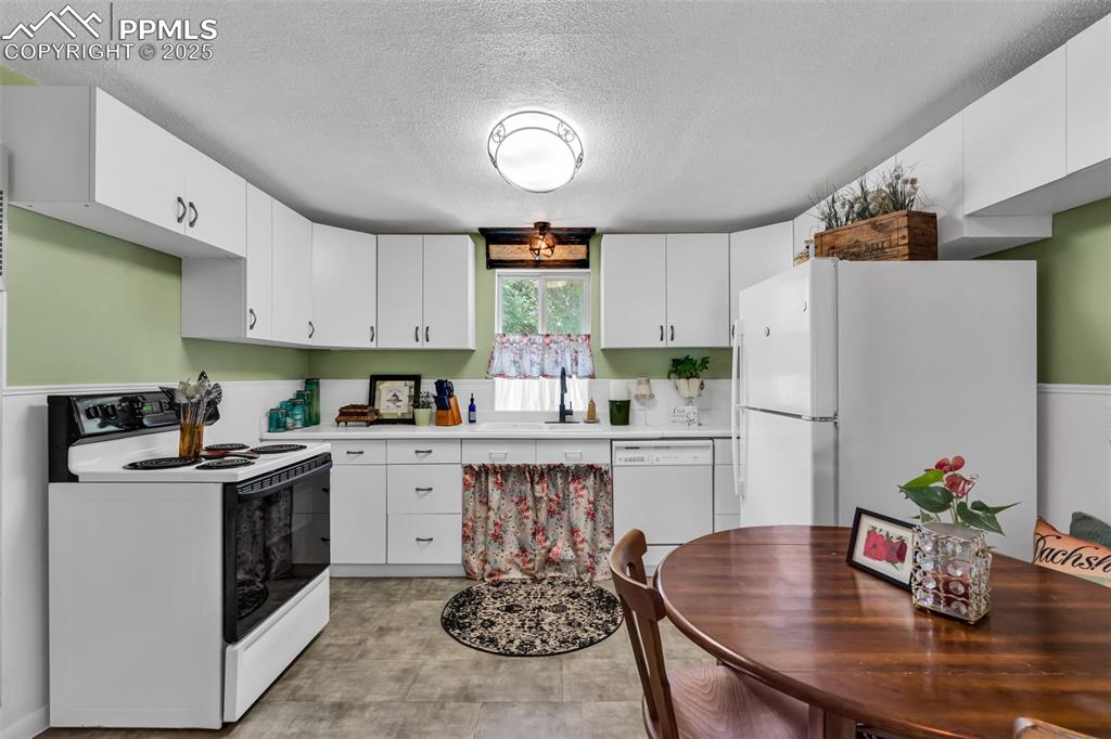 Image 17 of 44: The kitchen has plenty of cabinets and room for a dining table.  The master