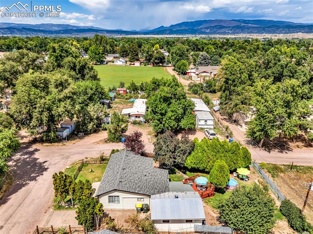 Image 36 of 44: View north of the surrounding homes and mountains.  The home is just minute