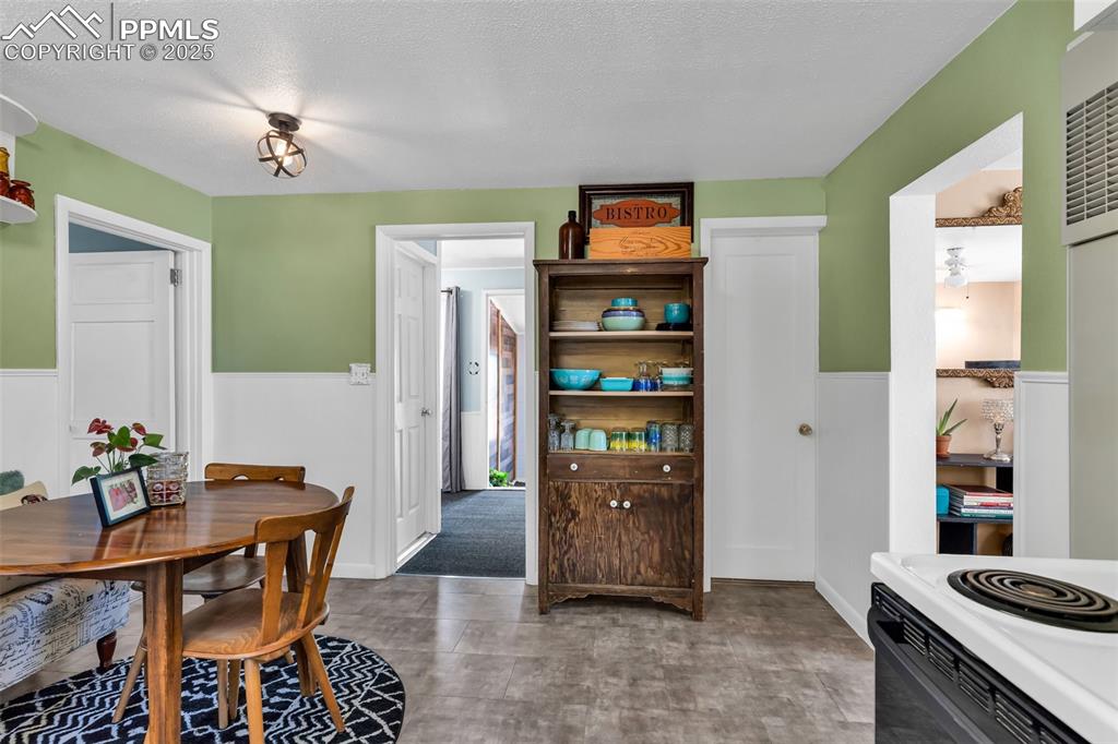 Image 6 of 44: The center doorway provides access to the basement. laundry and bonus room.