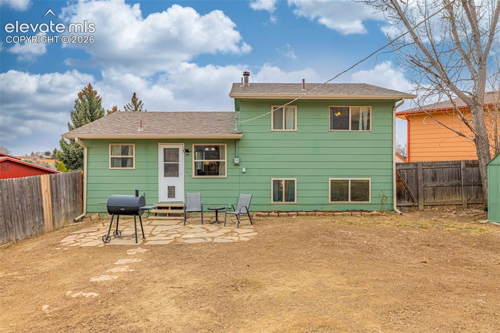 Image 26 of 30: Exterior featuring horizontal siding, a flagstone patio, and a fenced backy