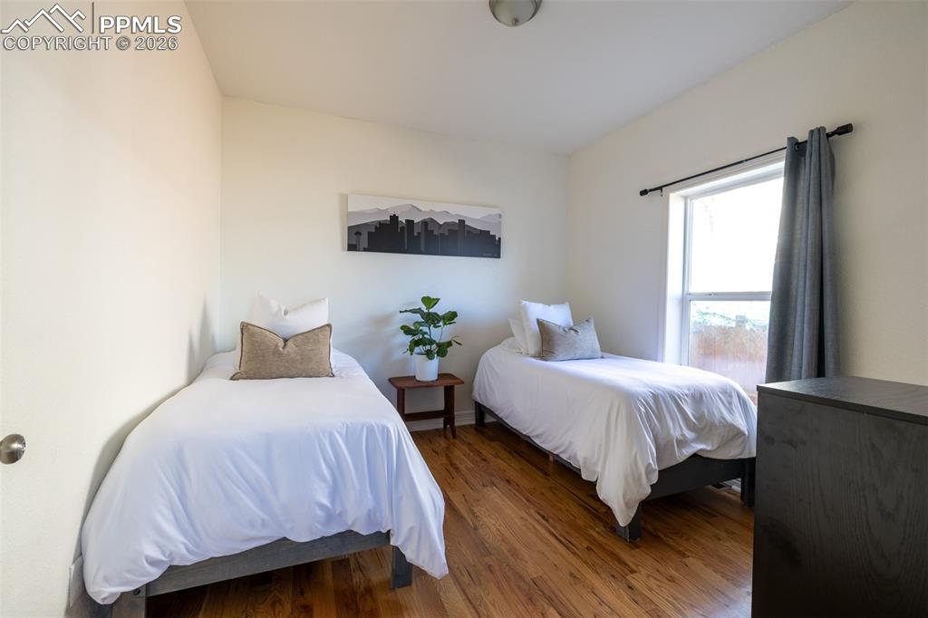 Image 21 of 50: 1st floor bedroom by entry