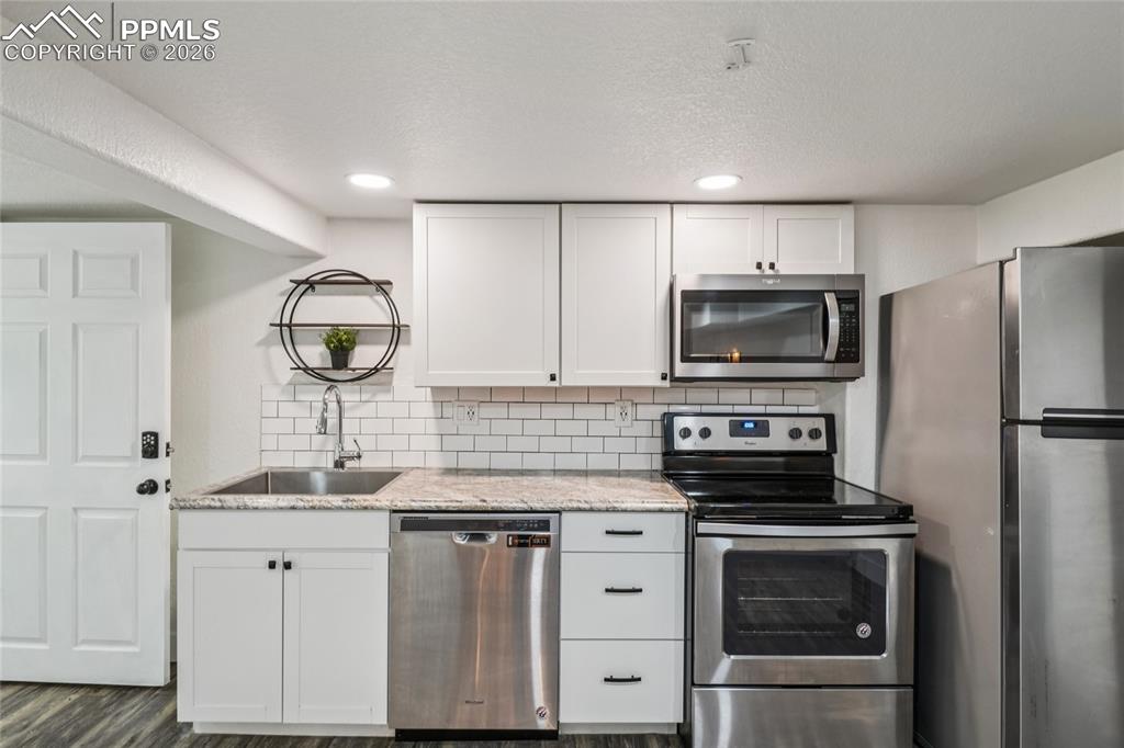 Image 36 of 50: basement kitchen