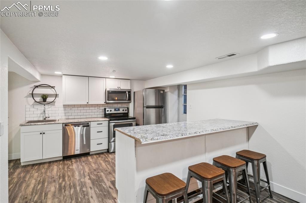 Image 37 of 50: basement kitchen