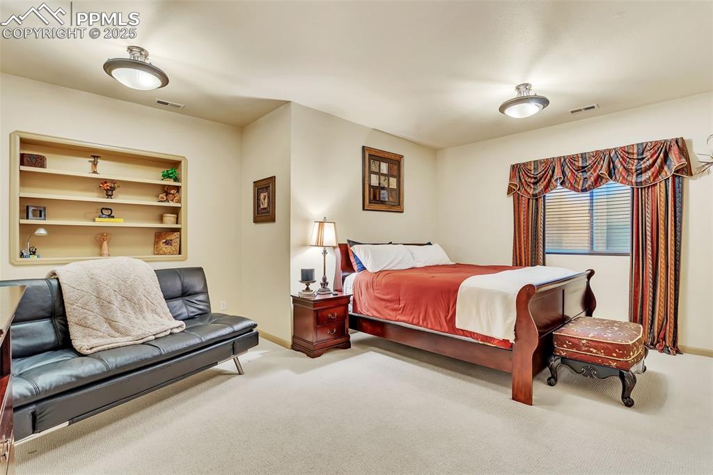Image 32 of 45: Bedroom featuring visible vents, carpet flooring, and baseboards