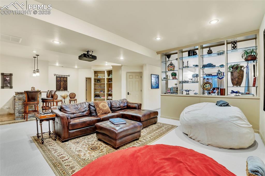 Image 38 of 45: Living room with baseboards, visible vents, and recessed lighting