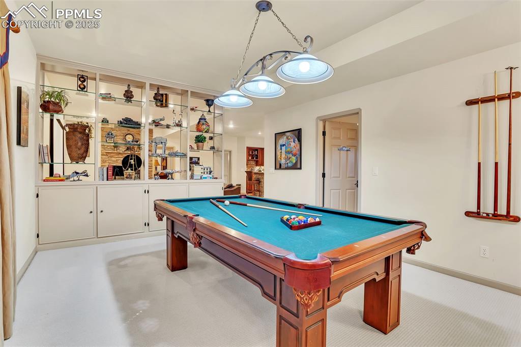 Image 39 of 45: Game room featuring baseboards, pool table, and light colored carpet