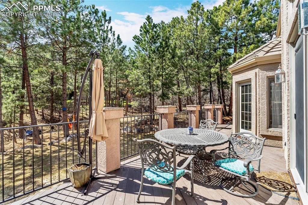 Image 41 of 45: Wooden terrace featuring outdoor dining area
