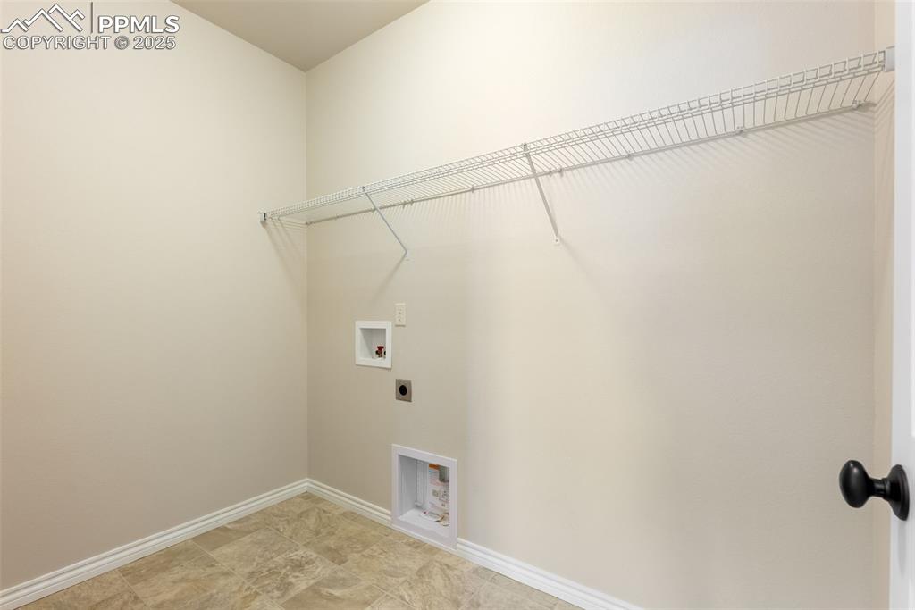 Image 19 of 43: Laundry room with hookup for a washing machine and electric dryer hookup