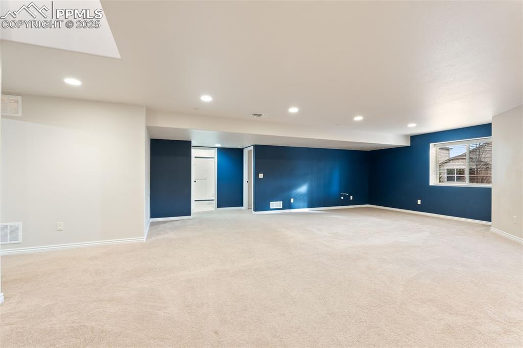 Image 28 of 43: Basement family room.