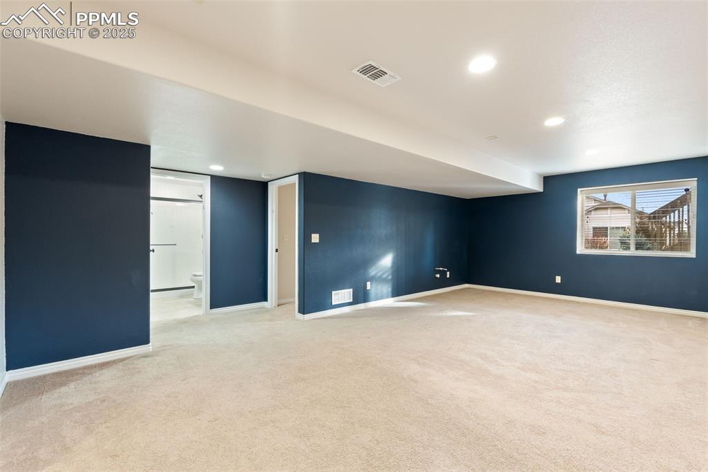 Image 30 of 43: Basement with light carpet and recessed lighting