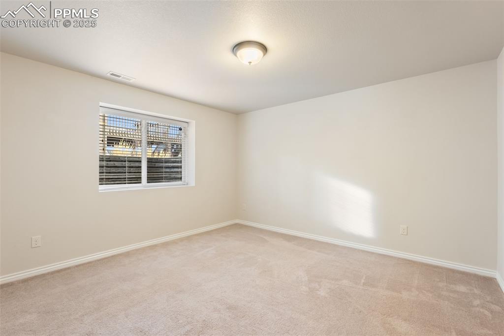 Image 31 of 43: Unfurnished room featuring baseboards and light colored carpet