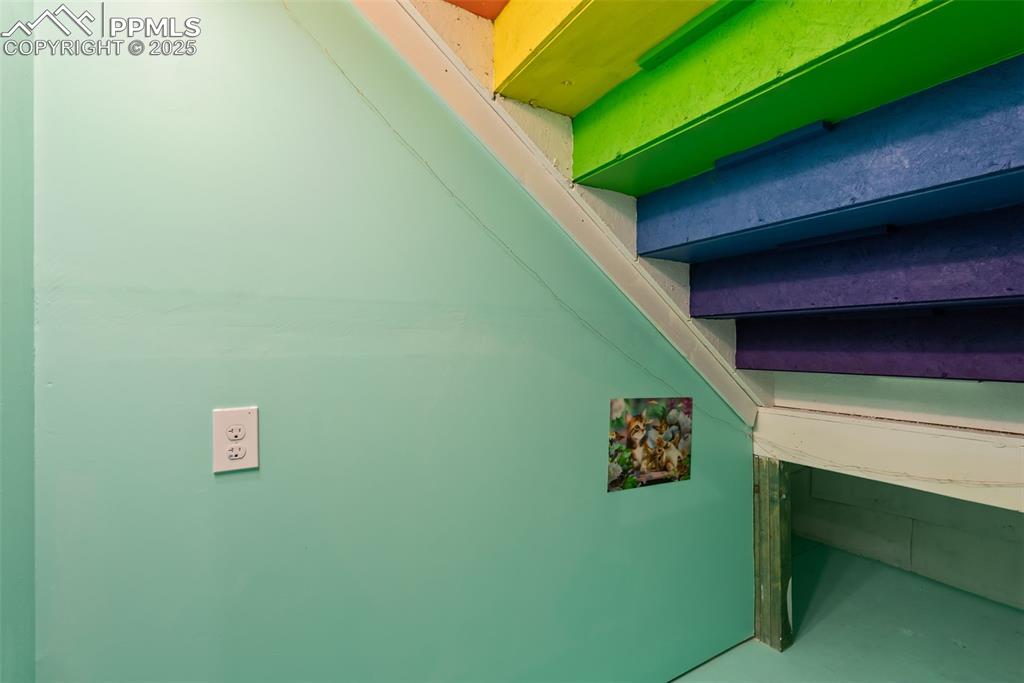Image 38 of 43: Kids play room under the stairs.