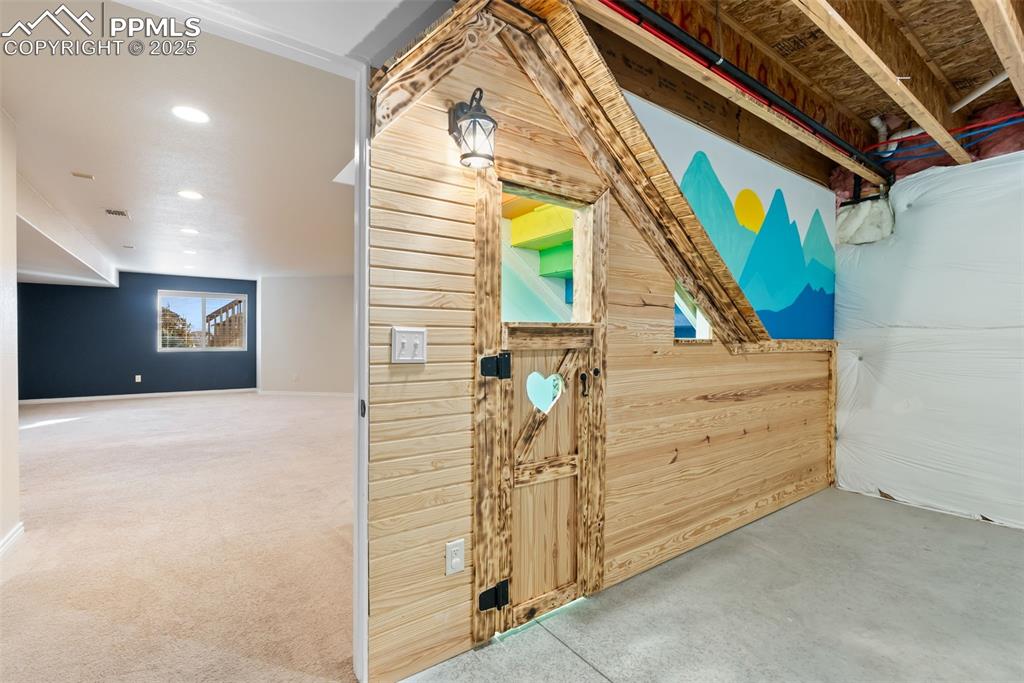 Image 44 of 50: Kids play room under the stairs.