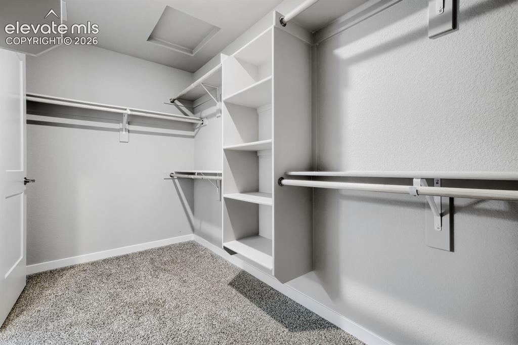 Image 26 of 31: Primary walk-in closet