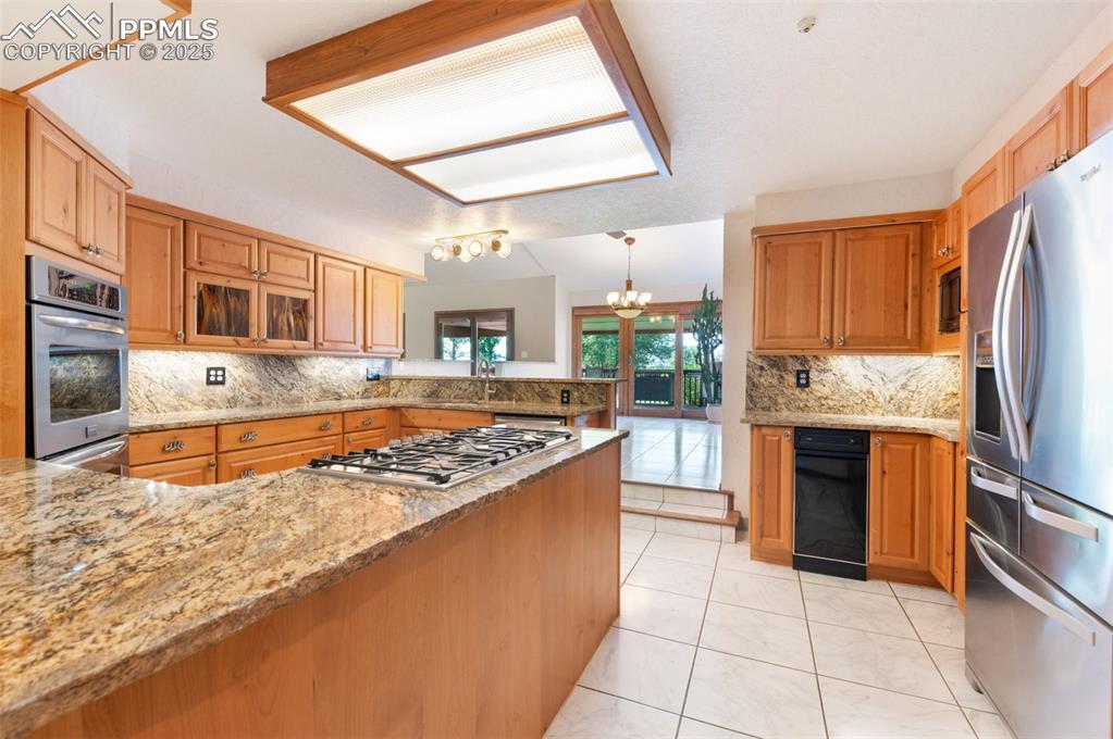 Image 11 of 50: Beautiful Kitchen Features Marble Tiled Flooring, A Trash Compactor, Gas Co