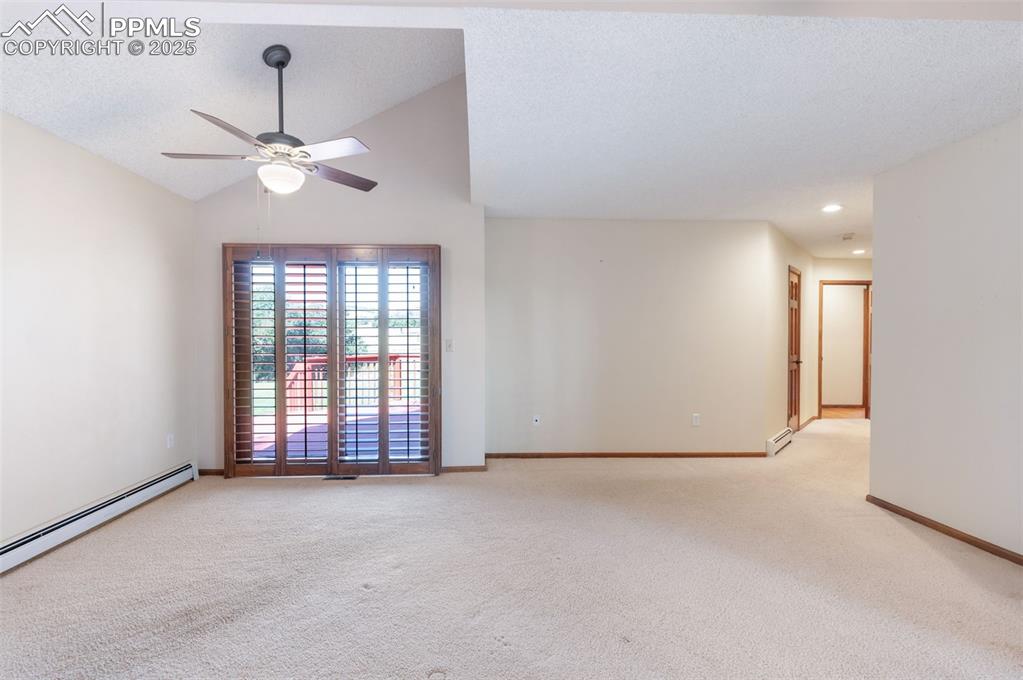Image 20 of 50: Spacious Main Level Primary Bedroom With Private Door To Deck