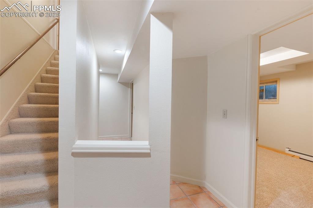 Image 35 of 50: Downstairs to 2 bedrooms, full bath and huge utility/storage room