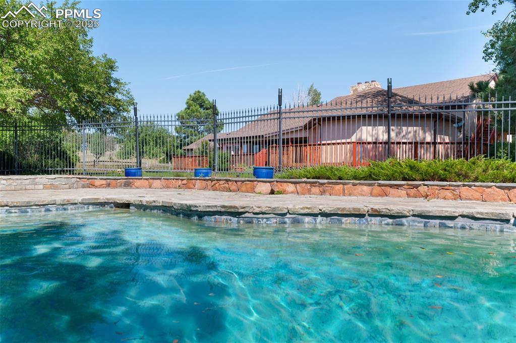 Image 42 of 50: Near The Pool Is A Gas Firepit Too!