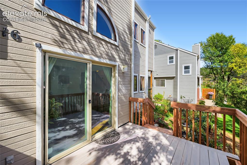 Image 28 of 37: Exterior siding with an integrated deck