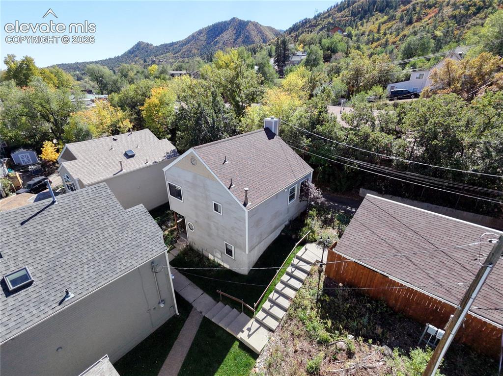 Image 35 of 37: Gabled roofline residence with a chimney