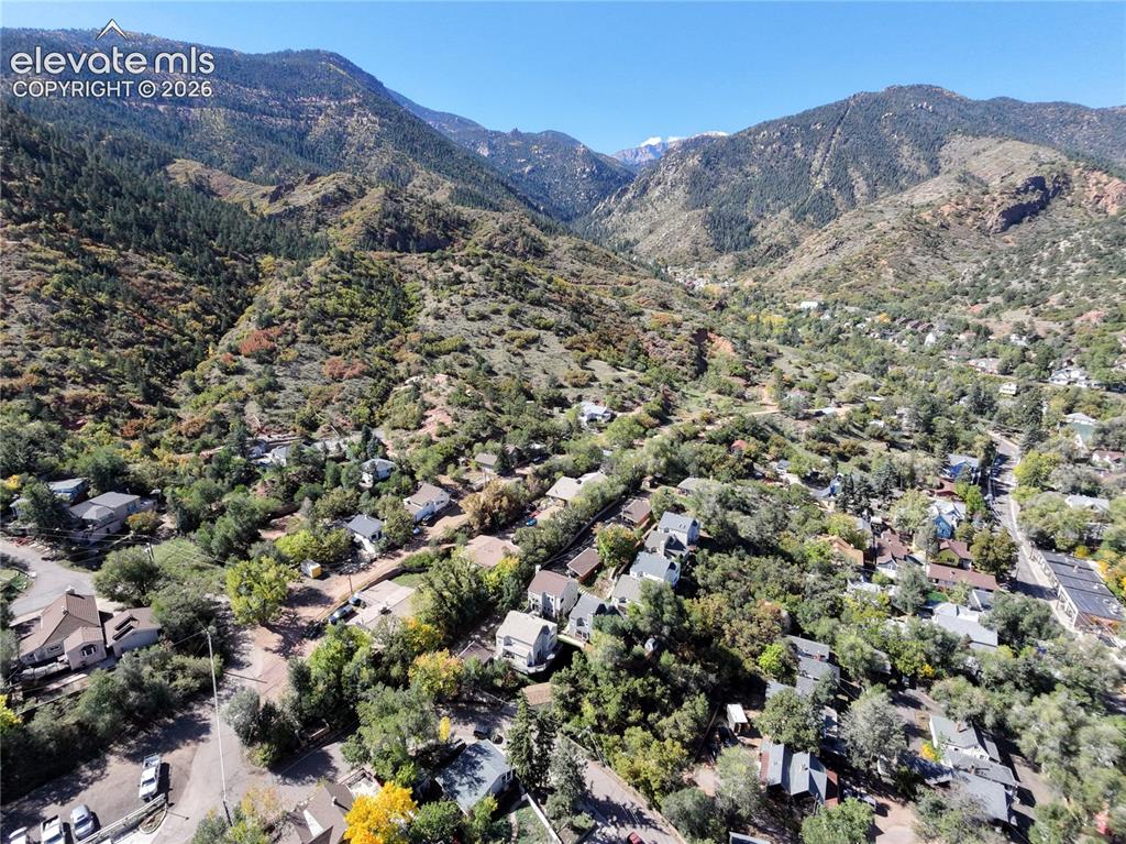 Image 36 of 37: Mountainous terrain with natural vegetation, residential properties nestled