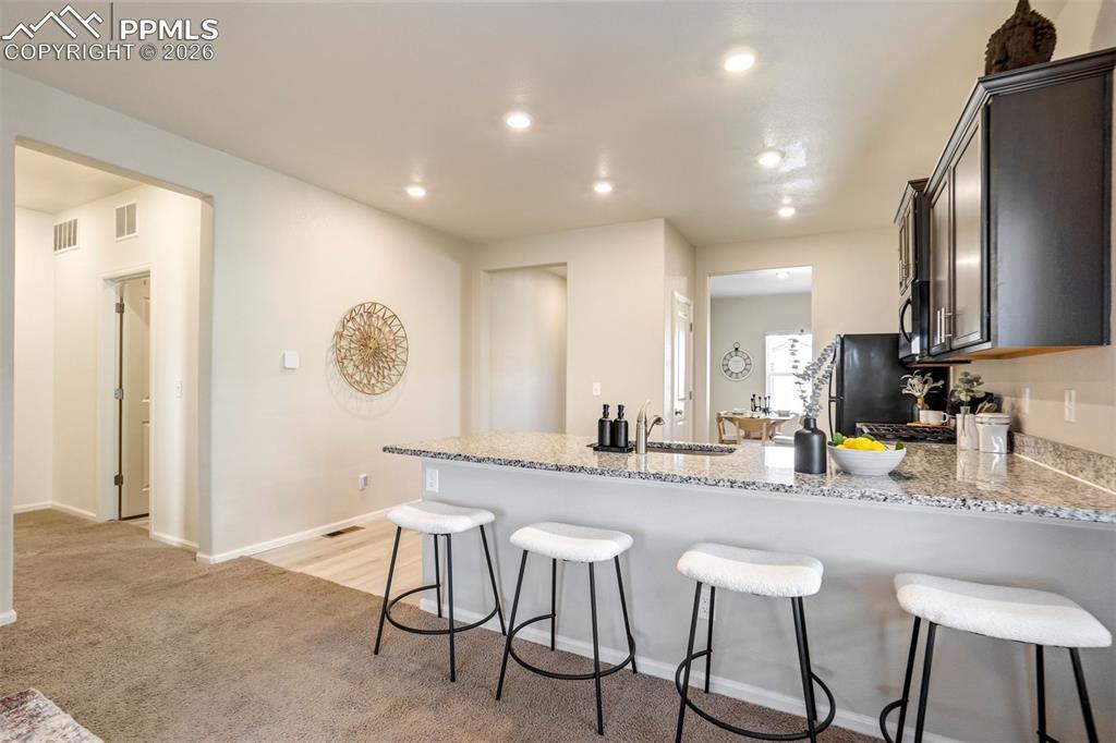 Image 11 of 41: Counter seating for everyday life. 