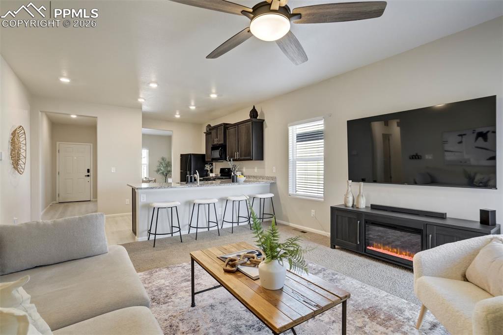 Image 2 of 41: Just the right amount of space for a comfy couch, a TV, and the remote cont