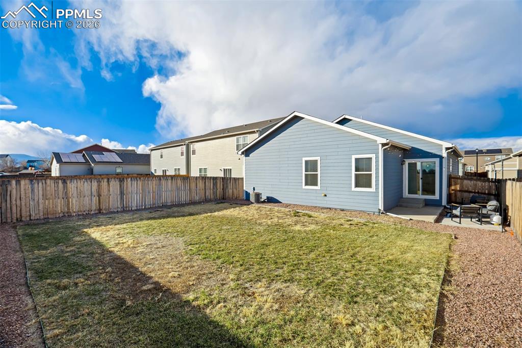 Image 34 of 41: Fully fenced and ready for that vegetable garden. 