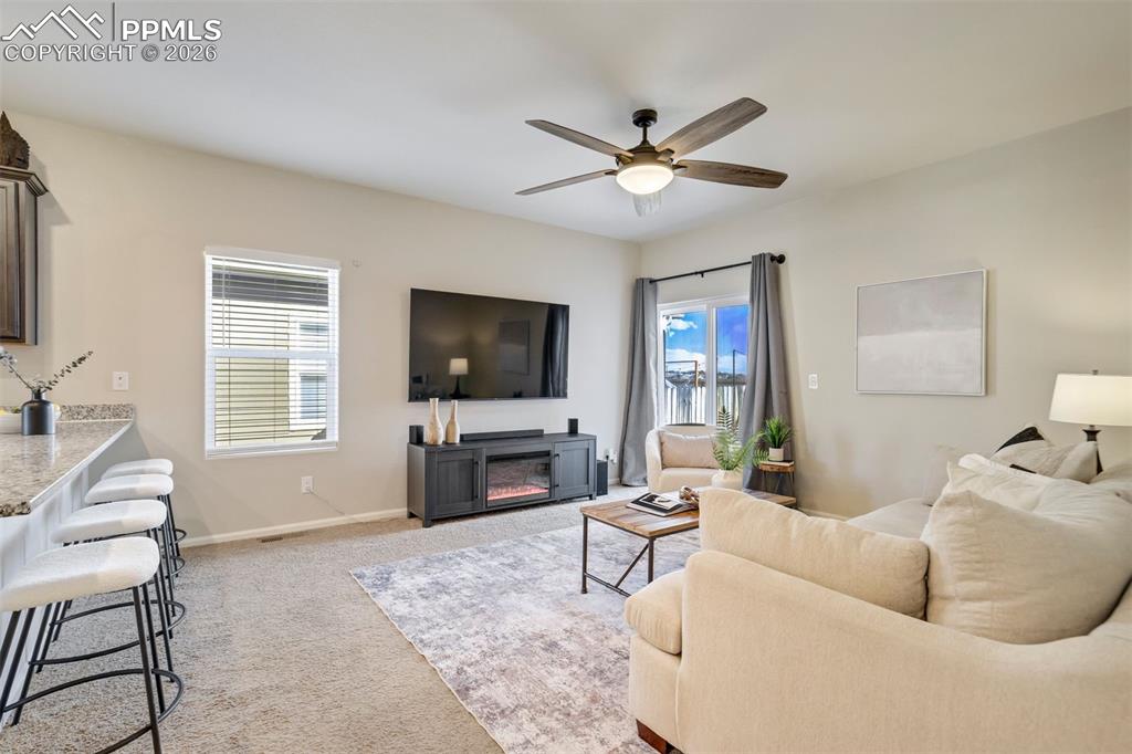 Image 4 of 41: Efficiently sized living room right off the kitchen— because the best conve