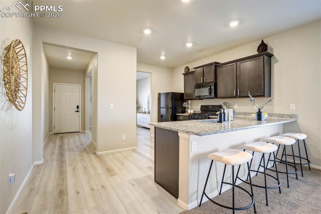 Image 5 of 41: Welcoming entry with tall ceilings.