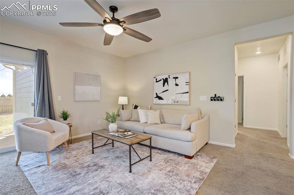 Image 6 of 41: Hallway off the living room leads to all 3 bedrooms. 
