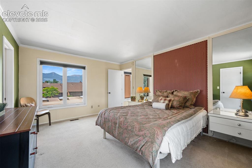 Image 28 of 48: Expansive window offering mountain scenery
