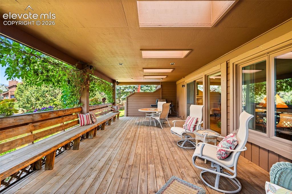 Image 35 of 48: Expansive outdoor deck featuring wood-finish flooring