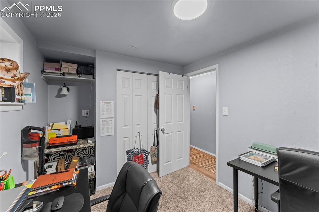 Image 36 of 47: Room featuring neutral-toned carpeting and light gray wall paint
