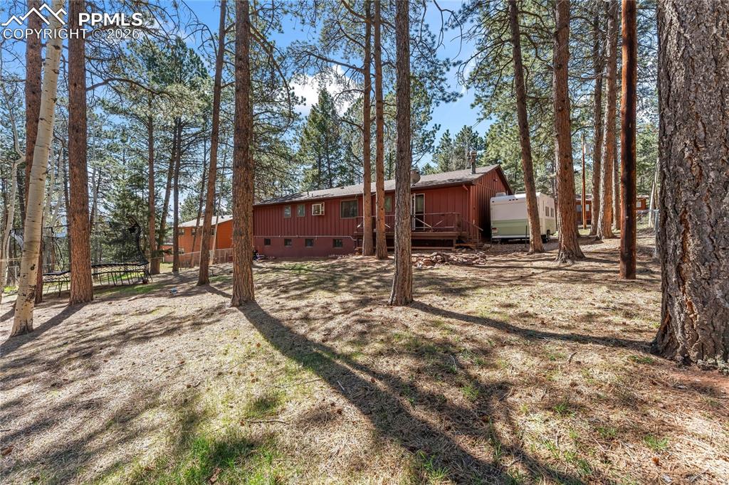 Image 42 of 47: Wood-sided exterior structure with a foundational base