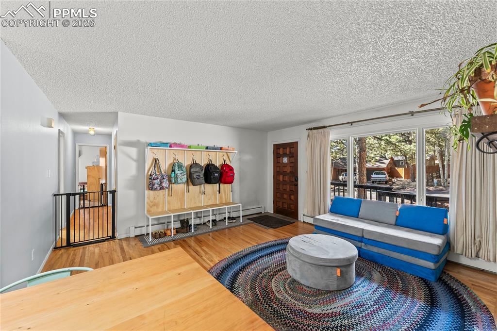 Image 8 of 47: Light wood-finish flooring throughout the main living area