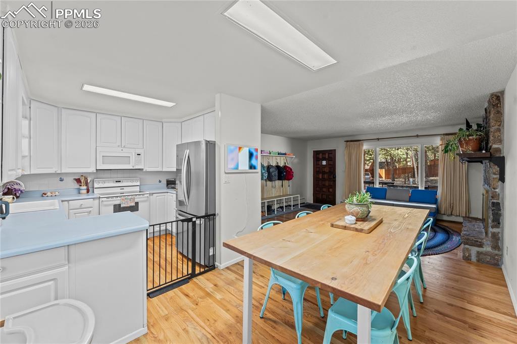 Image 9 of 47: Open-concept living space with wood-finish flooring
