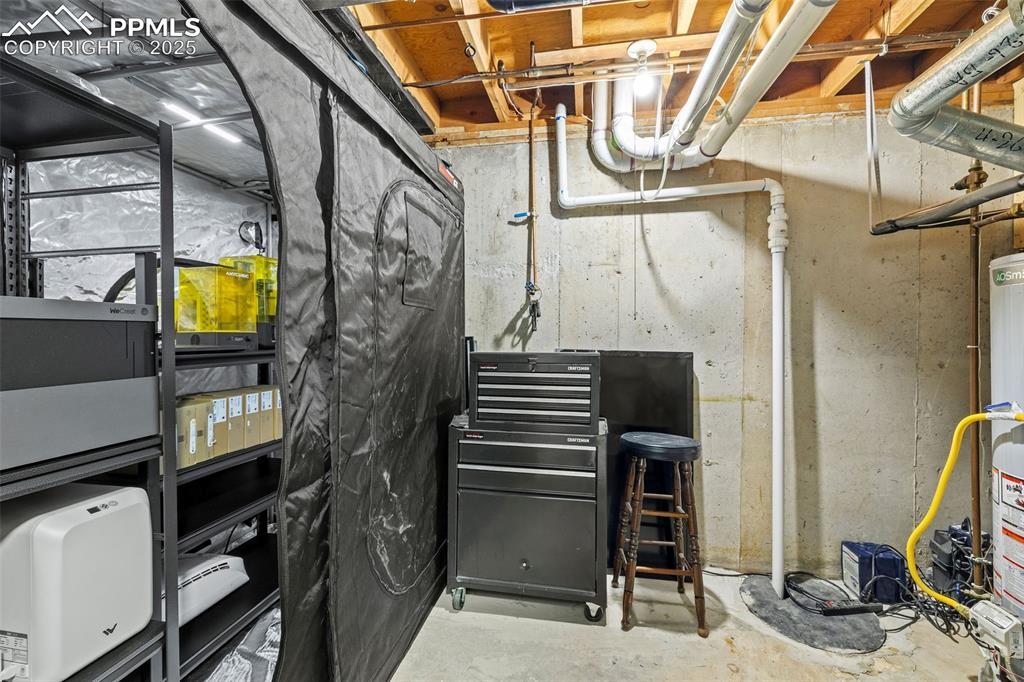 Image 37 of 50: Utility room featuring water heater