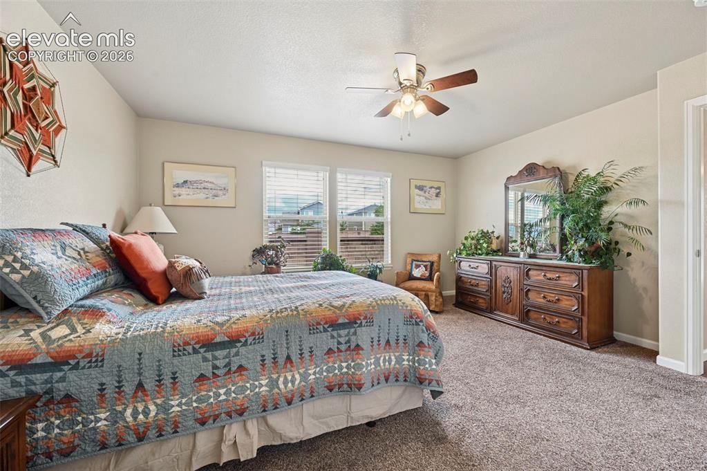 Image 4 of 38: Spacious Primary suite with a ceiling fan with integrated lighting