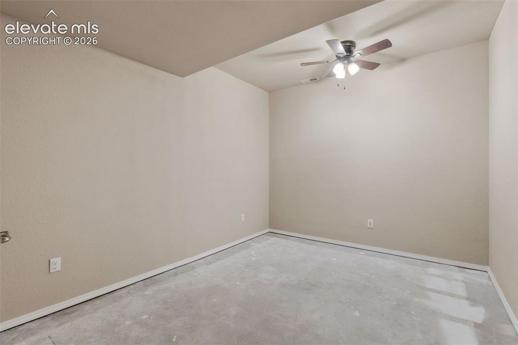 Image 26 of 50: Neutral tone painted walls and ceiling fan with integrated lighting