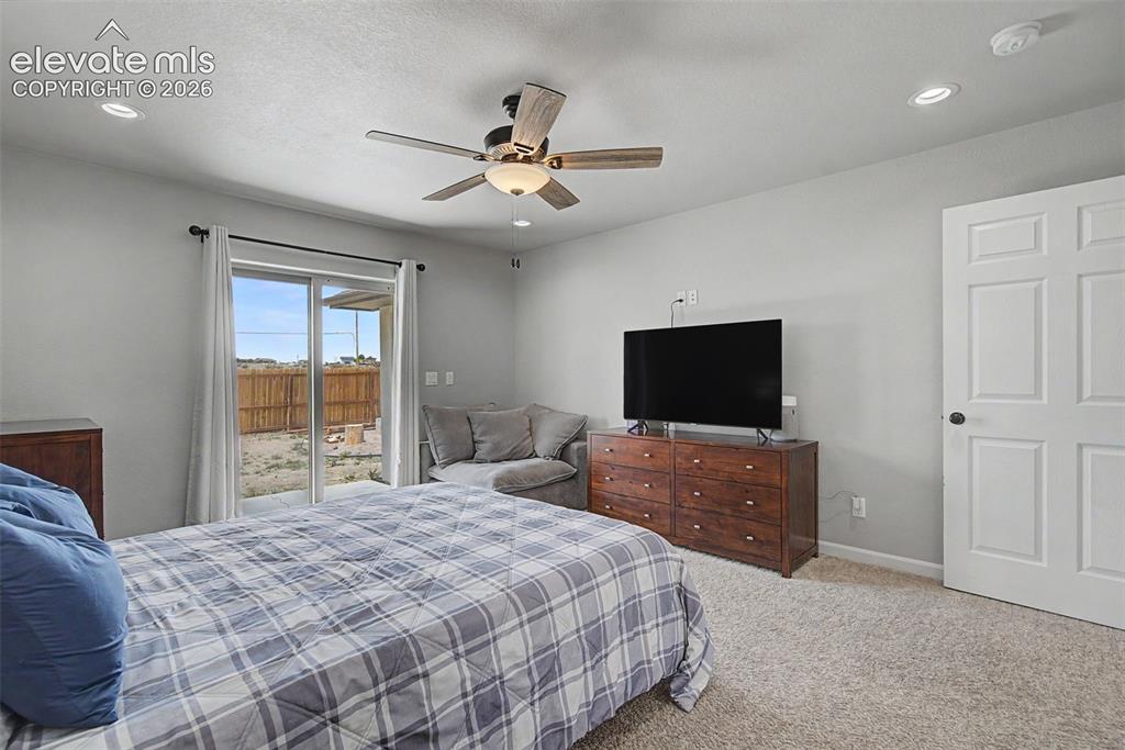Image 30 of 47: Carpeted room featuring a ceiling fan with integrated lighting, recessed li