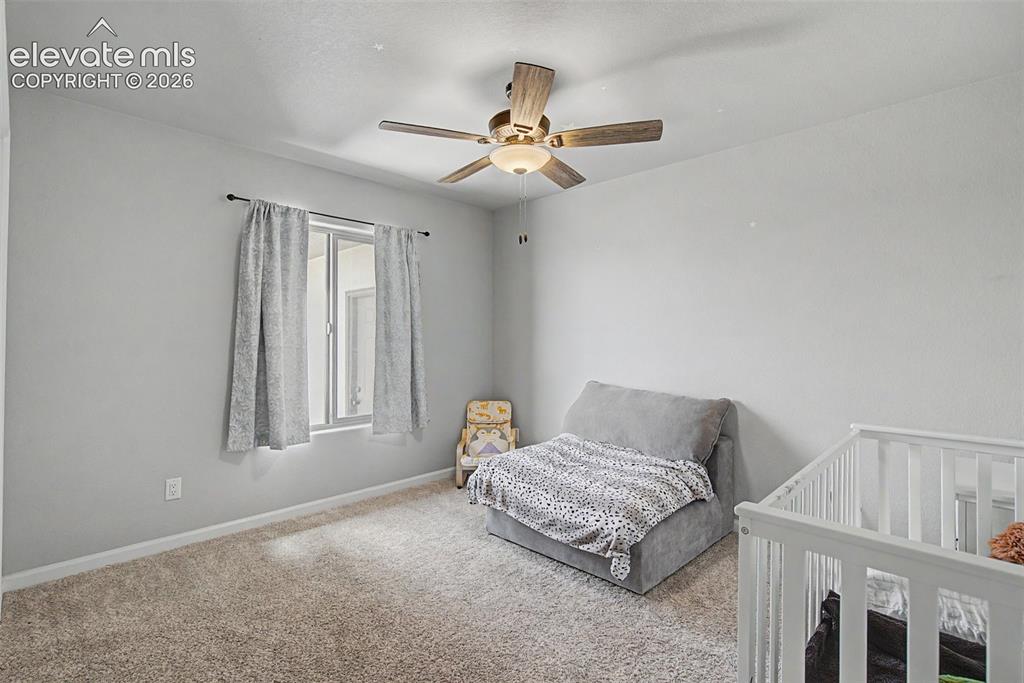 Image 37 of 47: Spacious room featuring neutral carpeting, light-toned walls, and a ceiling