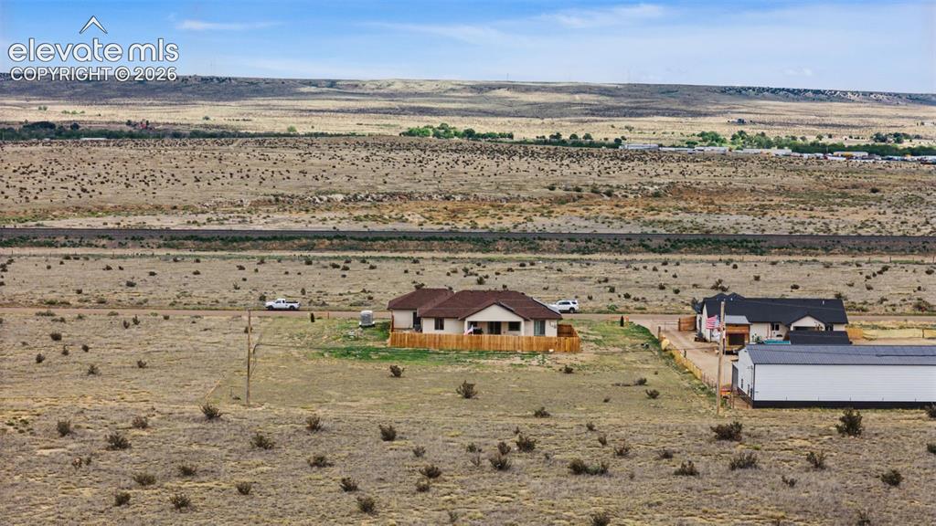 Image 46 of 47: Ranch-style residence featuring an earth-toned exterior and a brown shingle